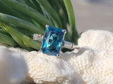 Platinum emerald cut blue zircon & baguette diamond estate ring