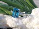 Platinum emerald cut blue zircon & baguette diamond estate ring