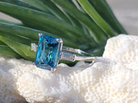 Platinum emerald cut blue zircon & baguette diamond estate ring