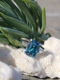 Platinum emerald cut blue zircon & baguette diamond estate ring