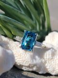 Platinum emerald cut blue zircon & baguette diamond estate ring