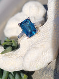 Platinum emerald cut blue zircon & baguette diamond estate ring