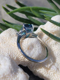 Platinum emerald cut blue zircon & baguette diamond estate ring