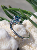 Platinum emerald cut blue zircon & baguette diamond estate ring