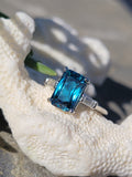 Platinum emerald cut blue zircon & baguette diamond estate ring