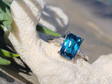 Platinum emerald cut blue zircon & baguette diamond estate ring