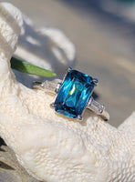 Platinum emerald cut blue zircon & baguette diamond estate ring