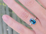 Platinum emerald cut blue zircon & baguette diamond estate ring