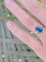 Platinum emerald cut blue zircon & baguette diamond estate ring