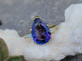18k gold pear cut tanzanite and baguette diamond estate ring