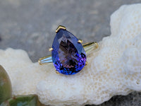 18k gold pear cut tanzanite and baguette diamond estate ring