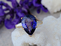 18k gold pear cut tanzanite and baguette diamond estate ring