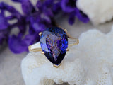 18k gold pear cut tanzanite and baguette diamond estate ring