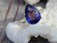 18k gold pear cut tanzanite and baguette diamond estate ring