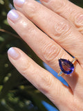 18k gold pear cut tanzanite and baguette diamond estate ring