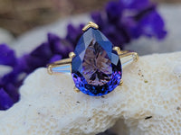 18k gold pear cut tanzanite and baguette diamond estate ring