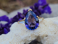 18k gold pear cut tanzanite and baguette diamond estate ring