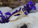 18k gold pear cut tanzanite and baguette diamond estate ring