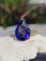 18k gold pear cut tanzanite and baguette diamond estate ring
