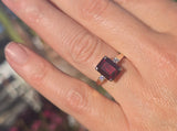 14k gold emerald cut garnet and diamond estate ring