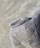 Platinum channel set diamond estate band