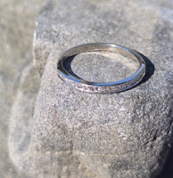 Platinum channel set diamond estate band