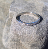 Platinum channel set diamond estate band