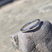 Platinum channel set diamond estate band