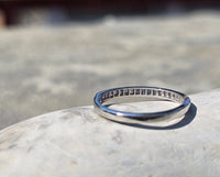 Platinum channel set diamond estate band