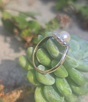 silver top and 10ct gold two tone pearl and old cut diamond antique halo ring