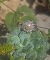 silver top and 10ct gold two tone pearl and old cut diamond antique halo ring
