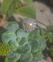 silver top and 10ct gold two tone pearl and old cut diamond antique halo ring