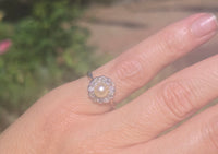silver top and 10ct gold two tone pearl and old cut diamond antique halo ring