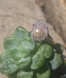 silver top and 10ct gold two tone pearl and old cut diamond antique halo ring