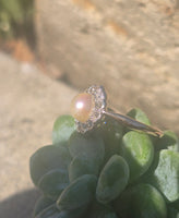 silver top and 10ct gold two tone pearl and old cut diamond antique halo ring