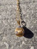 18k gold contemporary diamond necklace ball pendant