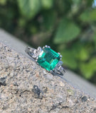 Platinum emerald and diamond estate ring