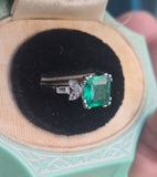 Platinum emerald and diamond estate ring