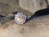 platinum pearl and diamond estate halo ring