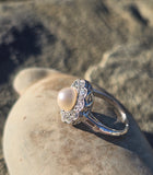 platinum pearl and diamond estate halo ring
