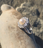 platinum pearl and diamond estate halo ring