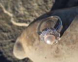 platinum pearl and diamond estate halo ring