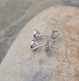 14k white gold bezel set European cut diamond studs earrings - .56ct tw