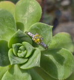 Platinum fancy yellow diamond estate ring