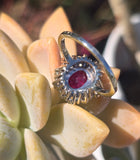 18ct white gold ruby and mine cut diamond estate halo ring