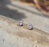platinum and 14k gold bezel set European cut diamond studs earrings - .28ct tw