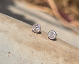 platinum and 14k gold bezel set European cut diamond studs earrings - .28ct tw