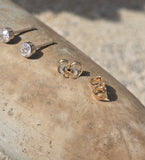 platinum and 14k gold bezel set European cut diamond studs earrings - .28ct tw