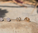 platinum and 14k gold bezel set European cut diamond studs earrings - .28ct tw