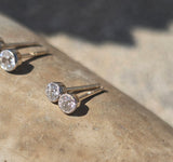 platinum and 14k gold bezel set European cut diamond studs earrings - .21ct tw